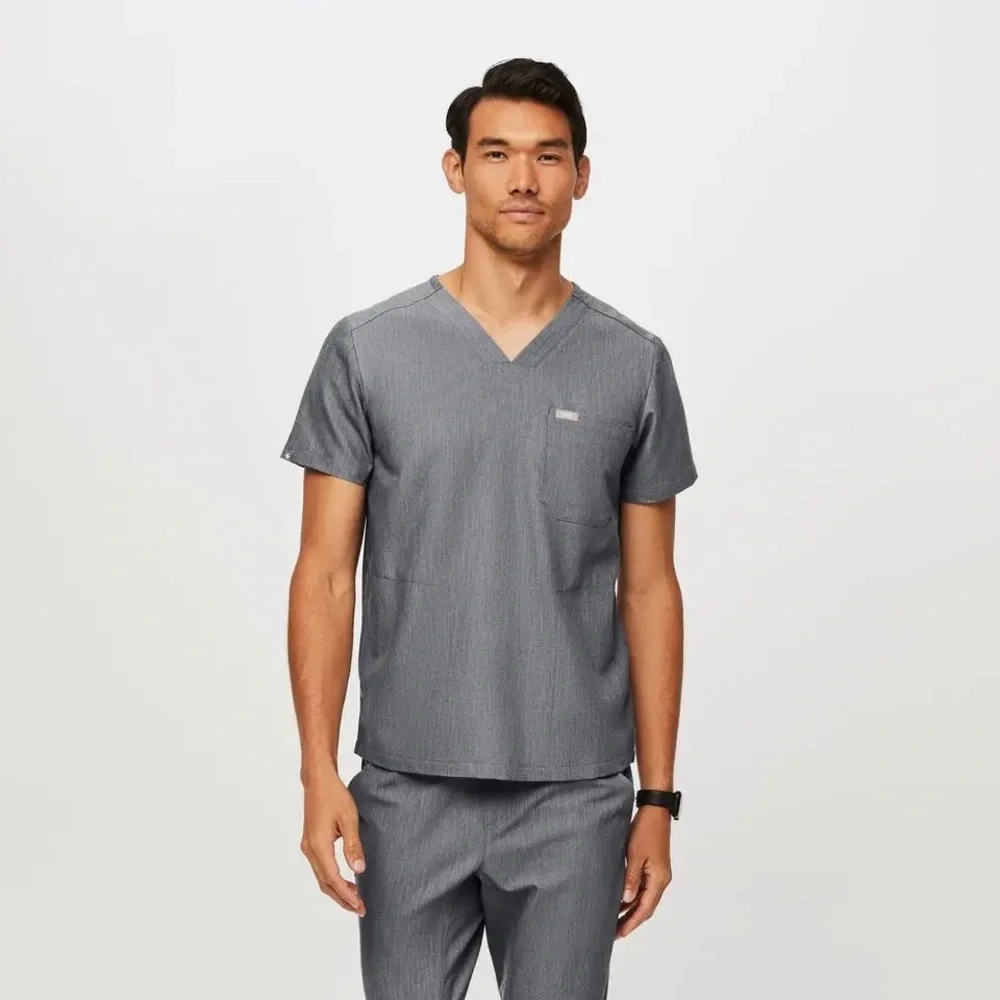 Men’s Chisec Three-Pocket Scrub Top in Graphite Gray.